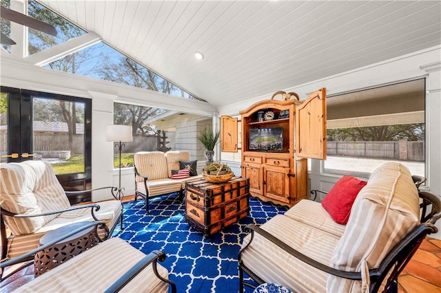 sunroom / solarium featuring lofted ceiling, a wealth of natural light, and wooden ceiling