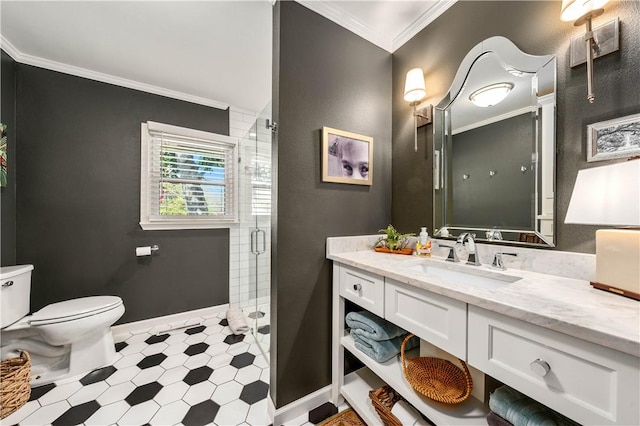 bathroom featuring crown molding, vanity, toilet, and an enclosed shower