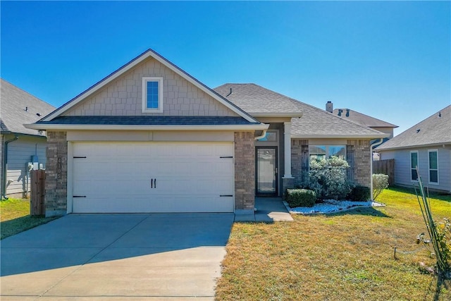 view of front of house featuring a garage and a front yard