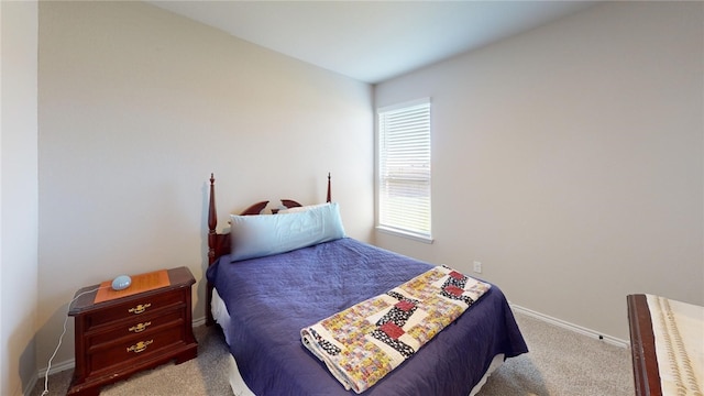 bedroom with light carpet