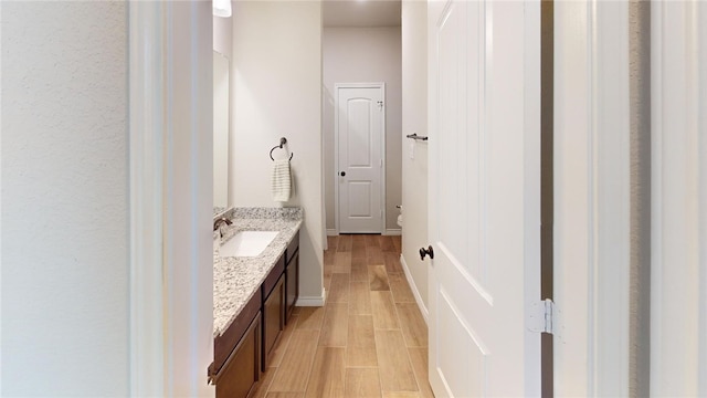 bathroom featuring hardwood / wood-style floors and vanity