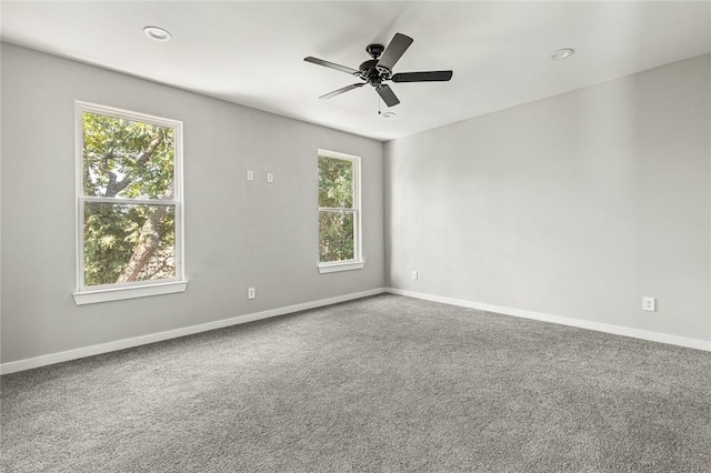 carpeted empty room with ceiling fan