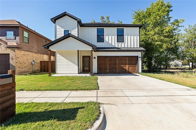 view of front facade with a front lawn and a garage