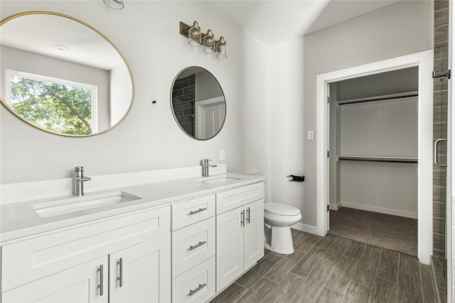 bathroom featuring hardwood / wood-style floors, vanity, and toilet