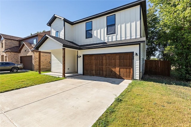 view of front of house with a garage and a front lawn