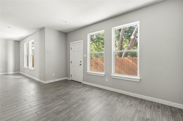 empty room with hardwood / wood-style flooring