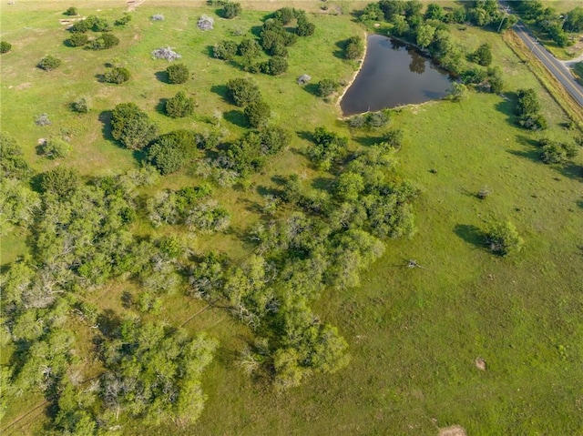 birds eye view of property with a rural view and a water view