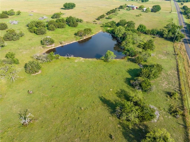 drone / aerial view featuring a rural view and a water view