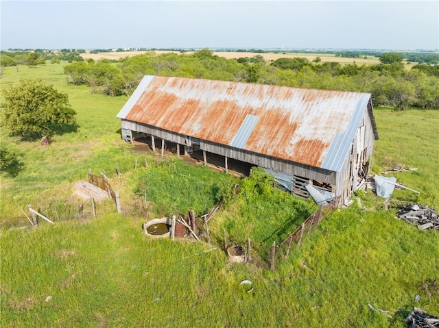 birds eye view of property with a rural view