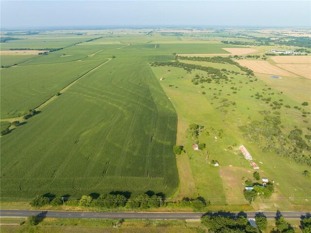 birds eye view of property with a rural view