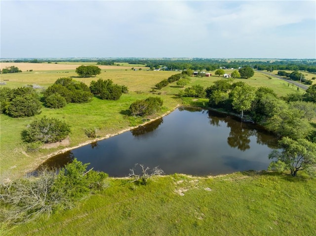 drone / aerial view with a rural view and a water view