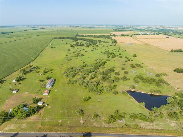 drone / aerial view featuring a rural view and a water view