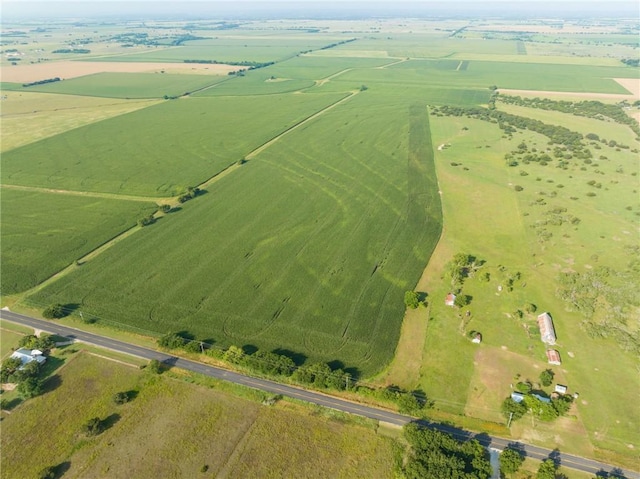 birds eye view of property with a rural view