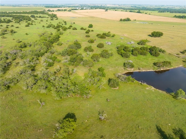 birds eye view of property featuring a rural view and a water view