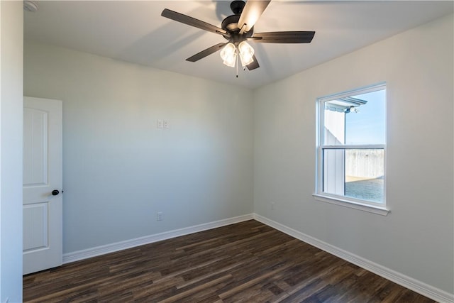 empty room featuring ceiling fan and dark hardwood / wood-style flooring