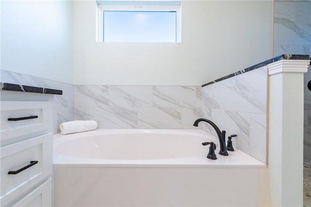 bathroom with a washtub