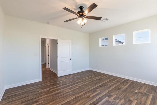 unfurnished room featuring ceiling fan and dark hardwood / wood-style flooring