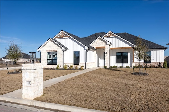 modern farmhouse with a front lawn