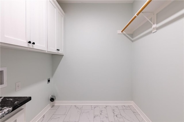 washroom with cabinets and hookup for an electric dryer