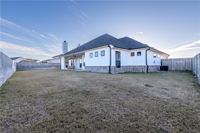 back of house featuring central AC