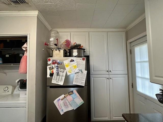 washroom featuring ornamental molding and washer / clothes dryer