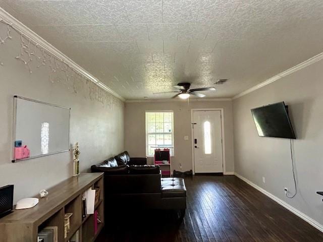 living room with a textured ceiling, dark hardwood / wood-style floors, ceiling fan, and crown molding