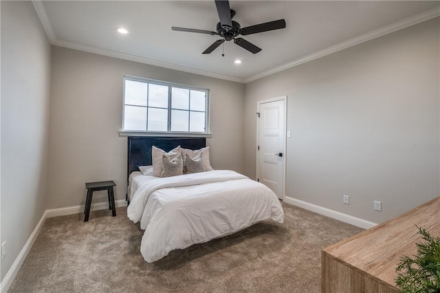 carpeted bedroom with ceiling fan and crown molding