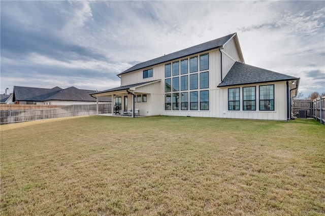 back of house with cooling unit, a patio area, and a lawn