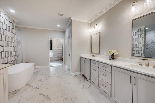 bathroom with a tub to relax in, vanity, and ornamental molding