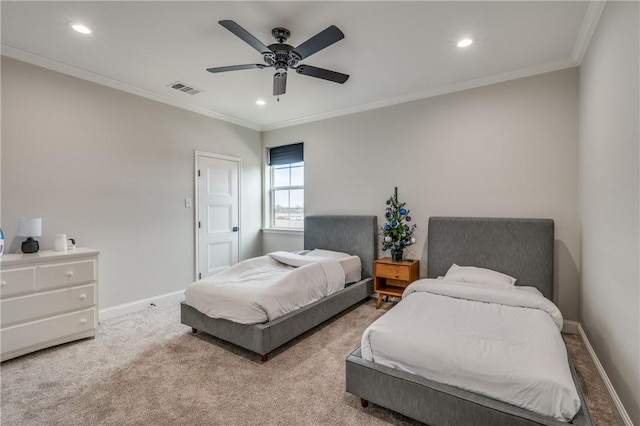 carpeted bedroom featuring ceiling fan and ornamental molding