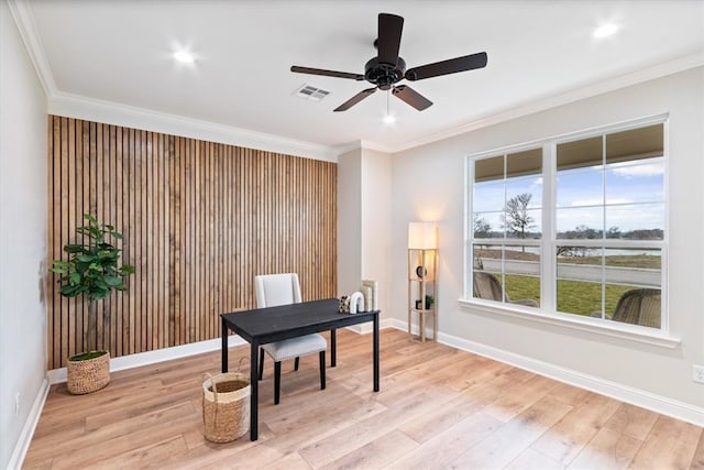 office space featuring light hardwood / wood-style flooring, ceiling fan, and ornamental molding