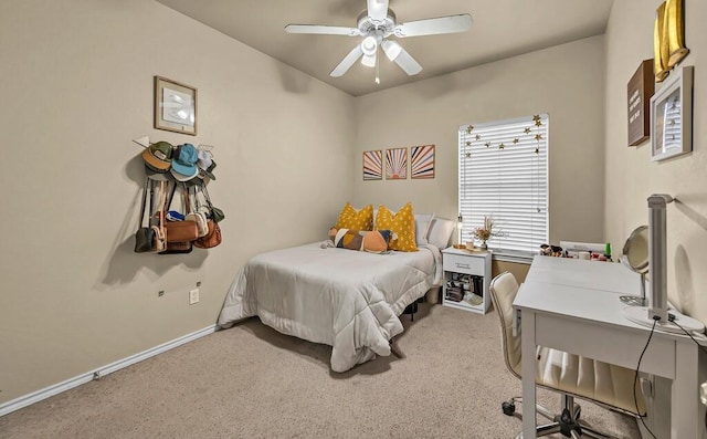 bedroom featuring carpet floors, baseboards, and a ceiling fan