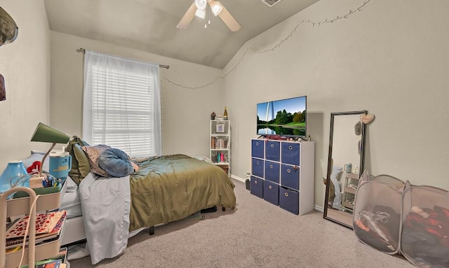 carpeted bedroom with lofted ceiling, ceiling fan, and visible vents