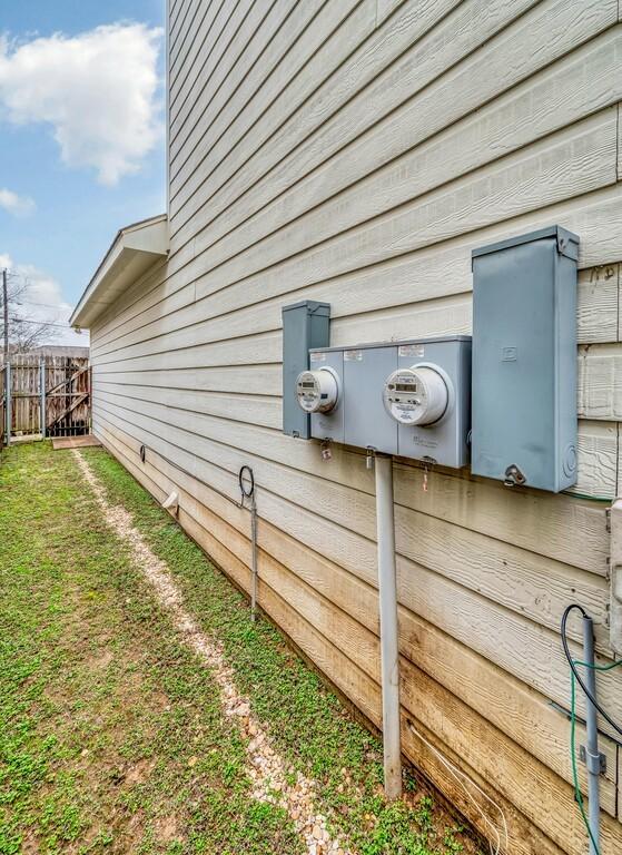 view of side of home with fence