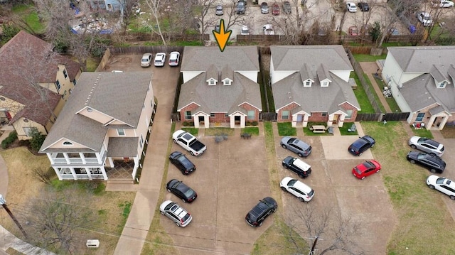 birds eye view of property with a residential view