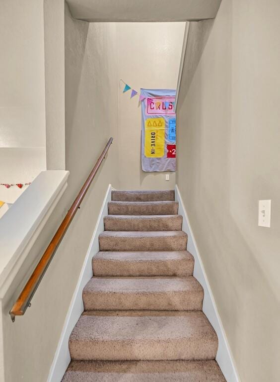 stairway featuring baseboards