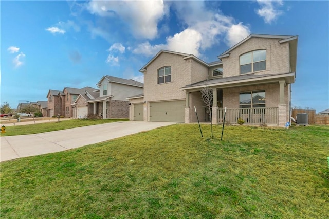 view of front property with cooling unit, a garage, covered porch, and a front lawn