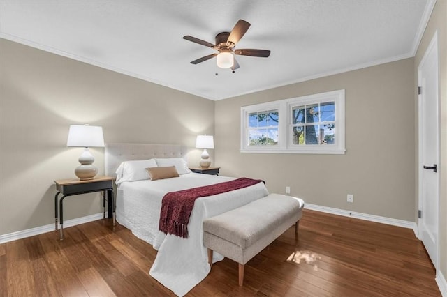 bedroom with ornamental molding, ceiling fan, and dark wood-type flooring