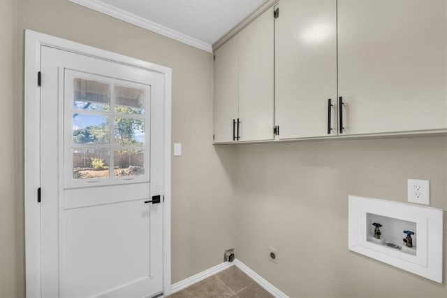 laundry area featuring hookup for an electric dryer, washer hookup, cabinets, ornamental molding, and light tile patterned floors