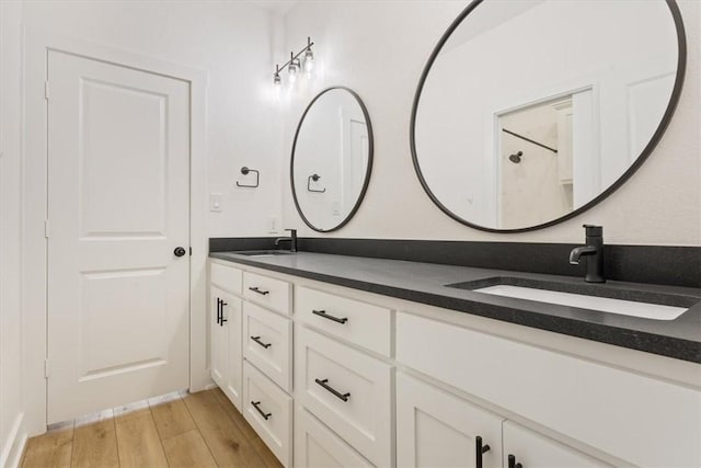 bathroom featuring hardwood / wood-style floors and vanity