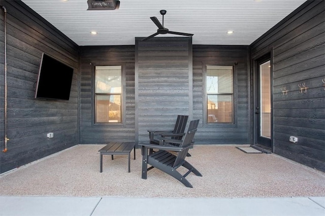 view of patio / terrace with ceiling fan and a porch