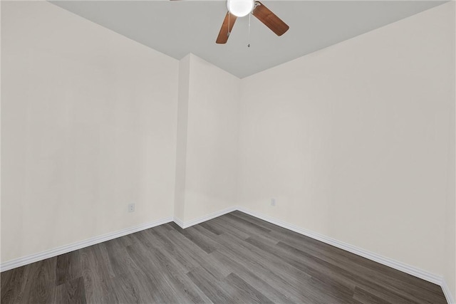 spare room featuring hardwood / wood-style floors and ceiling fan