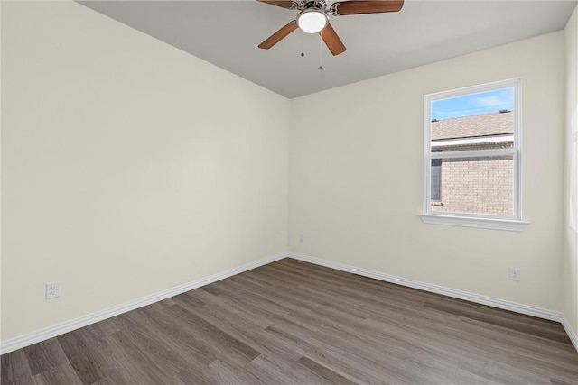 unfurnished room with ceiling fan and dark hardwood / wood-style floors