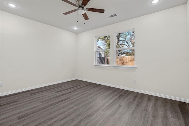 unfurnished room with ceiling fan and dark hardwood / wood-style floors