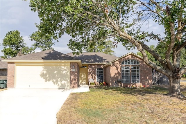 view of front of house featuring a garage and a front lawn