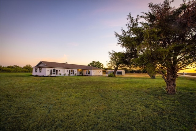 view of front of house with a lawn