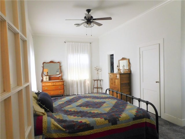 carpeted bedroom with ceiling fan and crown molding