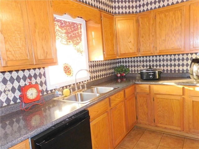 kitchen with dishwasher, backsplash, light tile patterned flooring, and sink