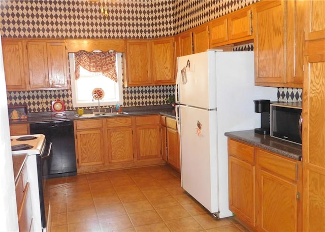 kitchen featuring white appliances, backsplash, and sink