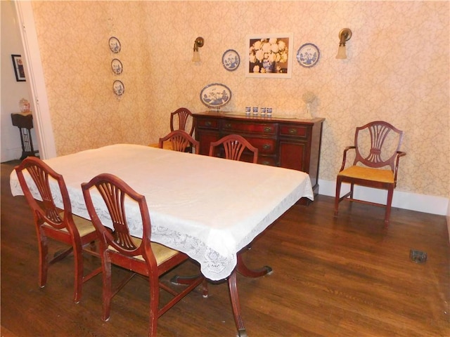 dining area with dark wood-type flooring